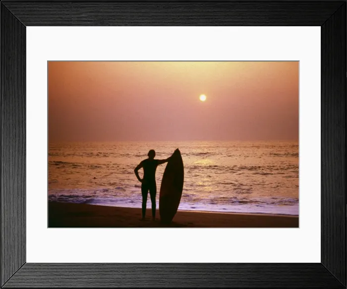 Framed Print : Surfer silhouetted against the sea Framed Print : Surfer silhouetted against the sea