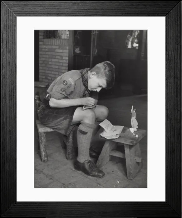 Framed Print : Dutch boy scout making model animal, Holland Framed Print : Dutch boy scout making model animal, Holland