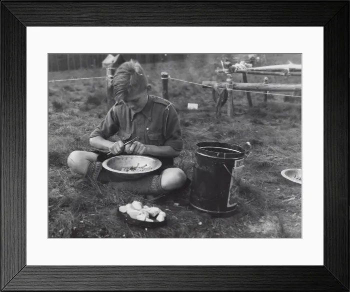 Framed Print : Dutch boy scout preparing vegetables, Holland Framed Print : Dutch boy scout preparing vegetables, Holland