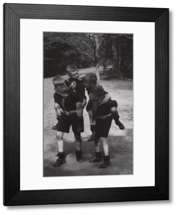 Framed Print : Dutch boy scouts playing piggyback, Holland Framed Print : Dutch boy scouts playing piggyback, Holland