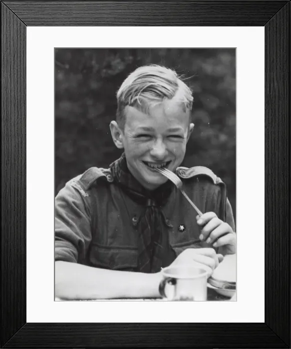 Framed Print : Dutch boy scout eating at camp, Holland Framed Print : Dutch boy scout eating at camp, Holland