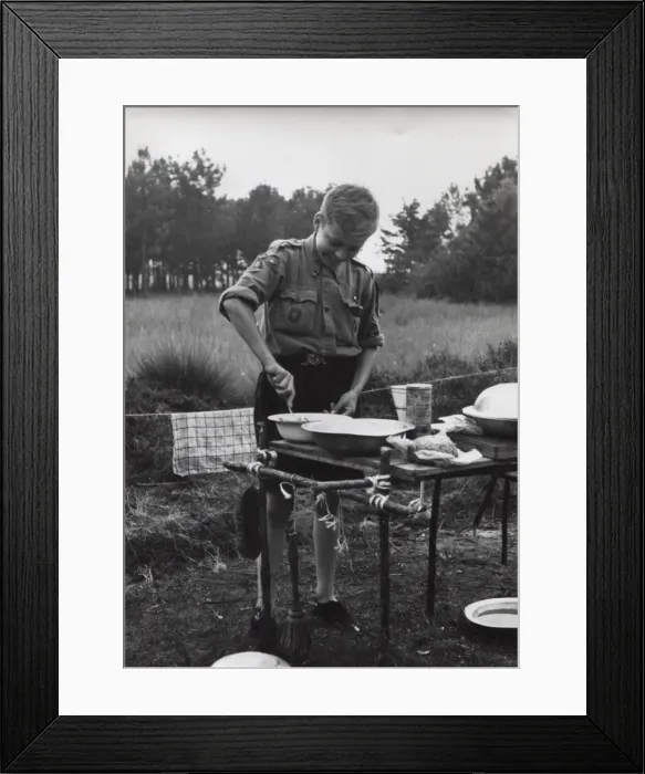 Framed Print : Dutch boy scout cooking at camp, Holland Framed Print : Dutch boy scout cooking at camp, Holland