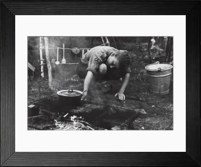Framed Print : Dutch boy scout cooking at camp, Holland Framed Print : Dutch boy scout cooking at camp, Holland