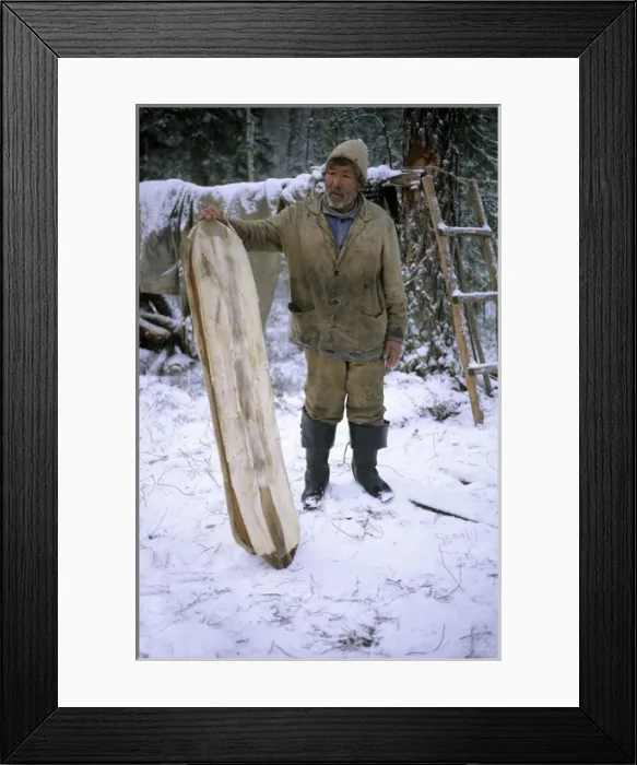 Framed Print : Selkup Man (North Siberia minority) shows his wooden Framed Print : Selkup Man (North Siberia minority) shows his wooden