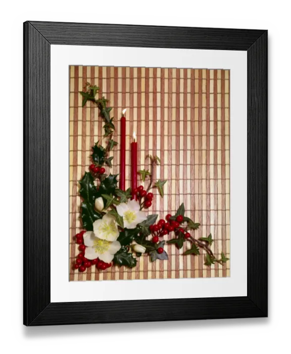 Framed Print : Christmas arrangement of candles, flowers and holly Framed Print : Christmas arrangement of candles, flowers and holly