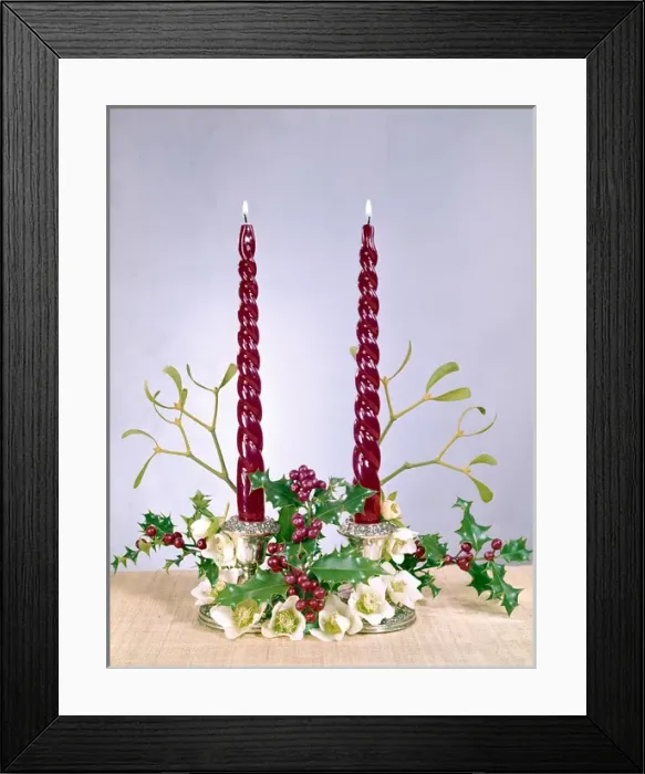 Framed Print : Christmas arrangement of candles, flowers and holly Framed Print : Christmas arrangement of candles, flowers and holly