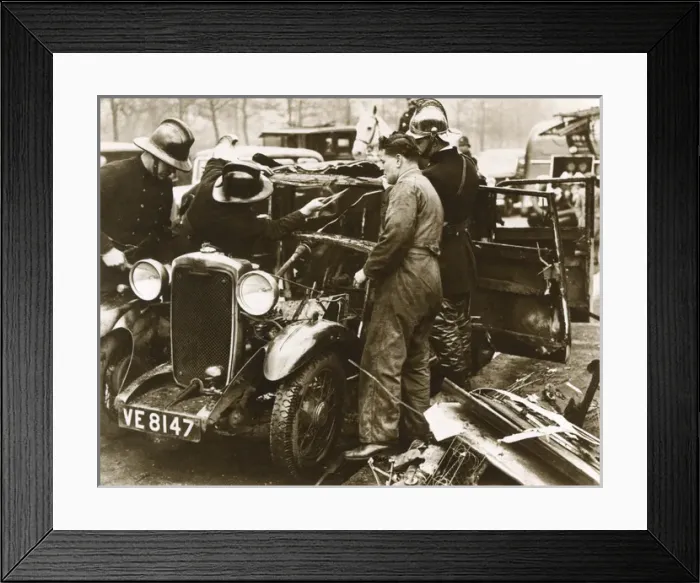Framed Print : Firemen and mechanic with burnt-out car, London