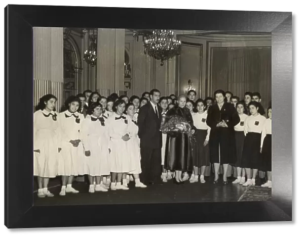 Eva Peron with delegation of teachers and students