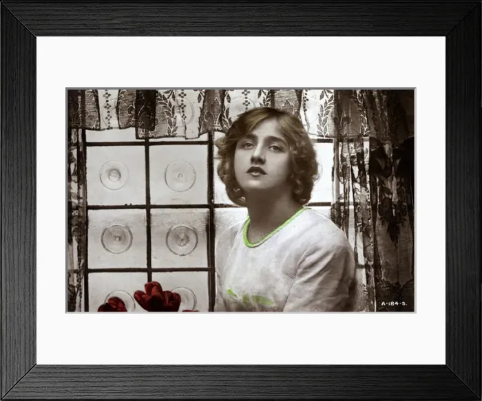 Framed Print : Young woman in front of window Framed Print : Young woman in front of window
