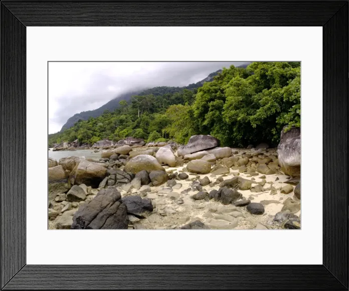 Framed Print : Boulders on sand beach and rainforest on slopes Framed Print : Boulders on sand beach and rainforest on slopes