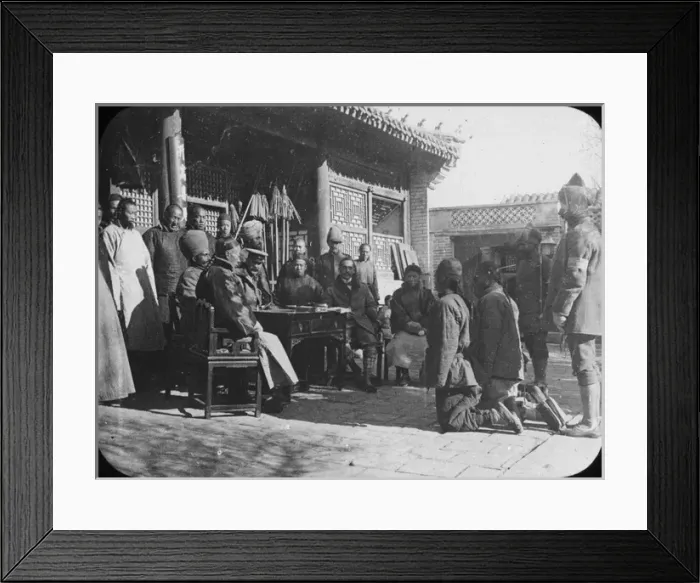 Framed Print : China - 2 men kneeling before a group Framed Print : China - 2 men kneeling before a group