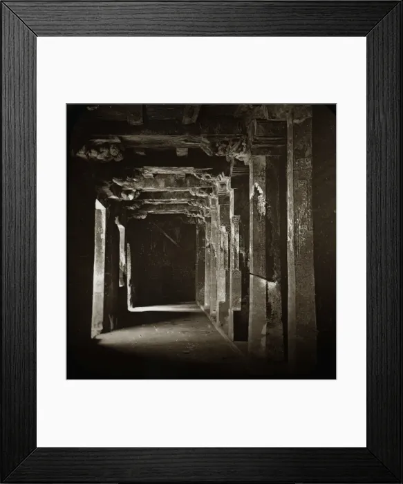 Framed Print : A dark corridor with many carved columns on each side Framed Print : A dark corridor with many carved columns on each side
