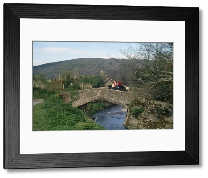 Framed Print : Two riders on Packhorse Bridge, Horner, Somerset Framed Print : Two riders on Packhorse Bridge, Horner, Somerset