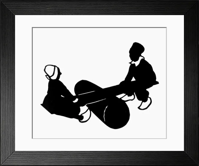 Framed Print : Silhouette of Dutch children on a seesaw Framed Print : Silhouette of Dutch children on a seesaw