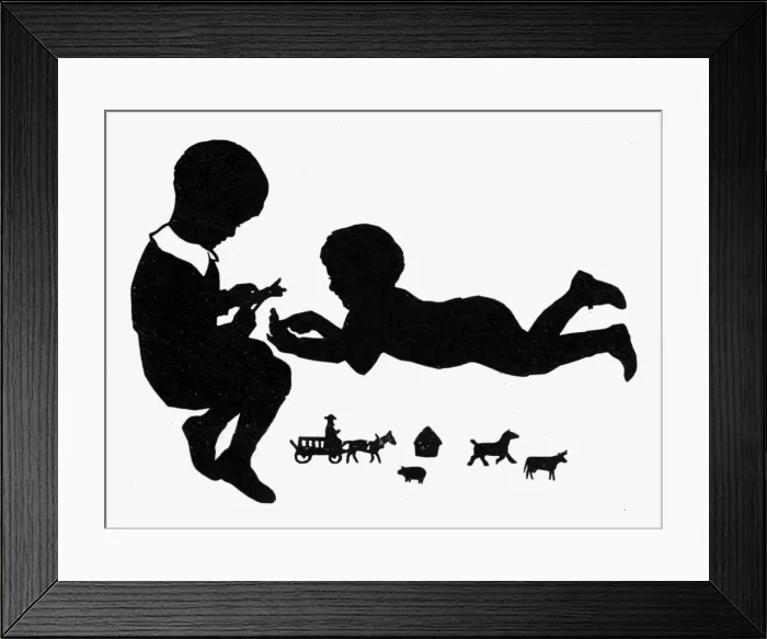 Framed Print : Silhouette of two children with cutout toys Framed Print : Silhouette of two children with cutout toys
