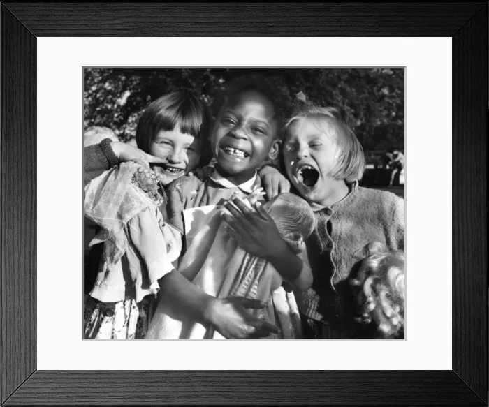 Framed Print : Girls with their dolls in Balham, SW London Framed Print : Girls with their dolls in Balham, SW London