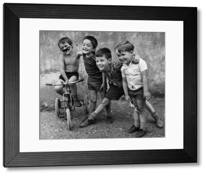 Framed Print : Boys with a tricycle in a Balham street, SW London Framed Print : Boys with a tricycle in a Balham street, SW London