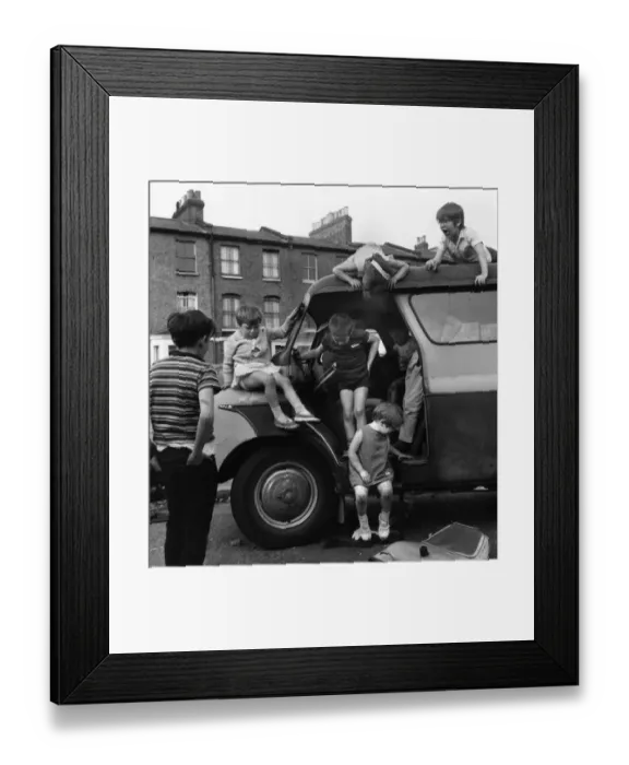 Framed Print : Children playing with a van in a Balham street, SW London Framed Print : Children playing with a van in a Balham street, SW London