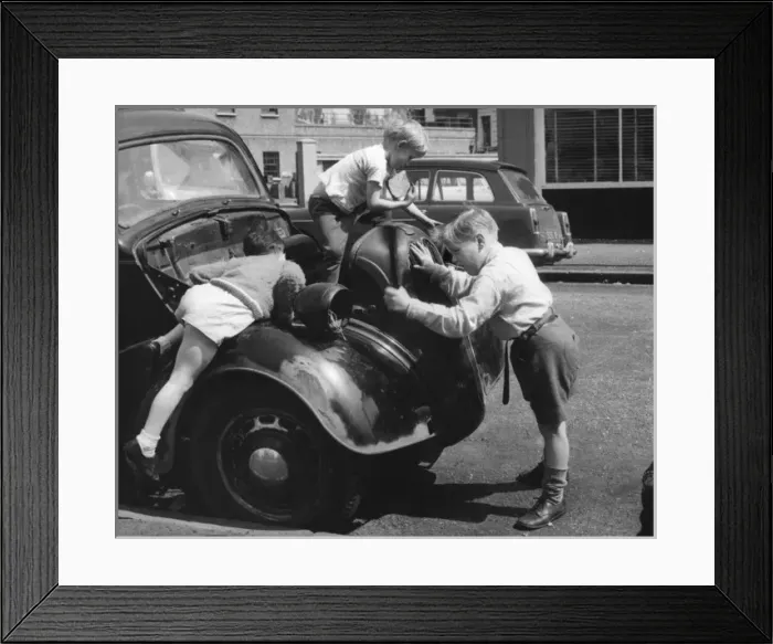Framed Print : Children playing on a car in a Balham street, SW London Framed Print : Children playing on a car in a Balham street, SW London