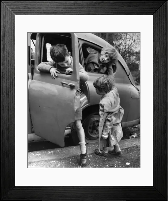 Framed Print : Children playing with a car in a Balham street, SW London Framed Print : Children playing with a car in a Balham street, SW London