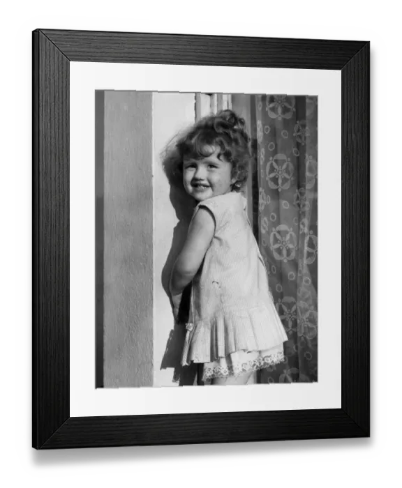 Framed Print : Little girl smiling, Balham, SW London Framed Print : Little girl smiling, Balham, SW London