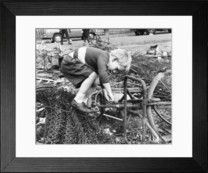 Framed Print : Boy playing with junk, Balham, SW London Framed Print : Boy playing with junk, Balham, SW London