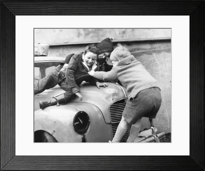Framed Print : Boys playing on a car in a Balham street, SW London Framed Print : Boys playing on a car in a Balham street, SW London