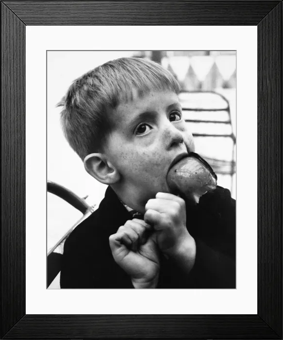 Framed Print : Little boy with toffee apple, Balham, SW London Framed Print : Little boy with toffee apple, Balham, SW London