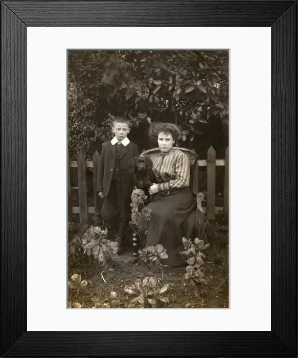 Framed Print : Woman and boy with dog in garden Framed Print : Woman and boy with dog in garden