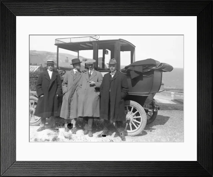 Framed Print : Group of men by a car Framed Print : Group of men by a car