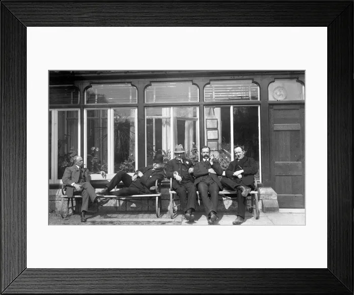 Framed Print : Five men relaxing on a bench Framed Print : Five men relaxing on a bench