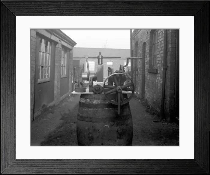 Framed Print : Pipe screwing machine for hat factory