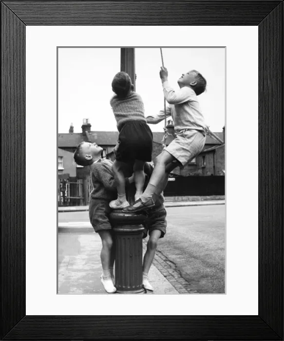 Framed Print : Boys on a lamp post on a Balham street, SW London Framed Print : Boys on a lamp post on a Balham street, SW London