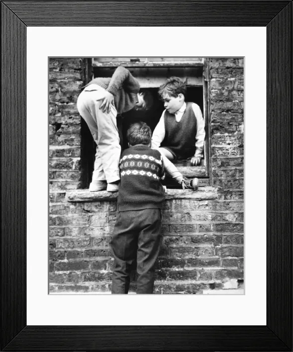 Framed Print : Boys at a boarded up window, Balham, SW London Framed Print : Boys at a boarded up window, Balham, SW London
