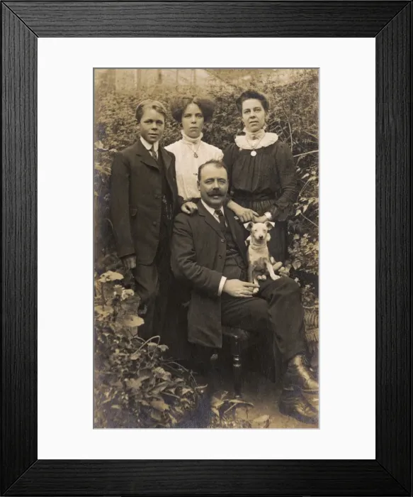 Framed Print : Family of four and dog in garden Framed Print : Family of four and dog in garden