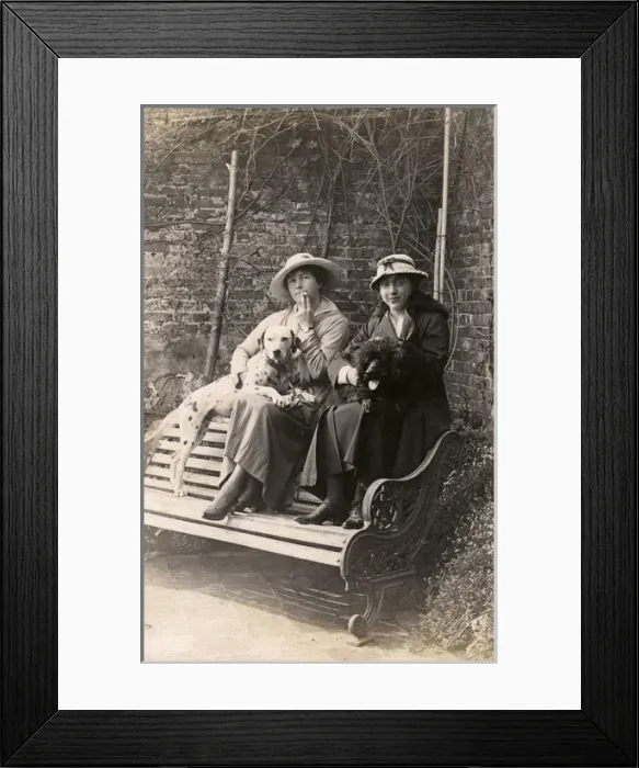 Framed Print : Two women and their dogs in a garden Framed Print : Two women and their dogs in a garden