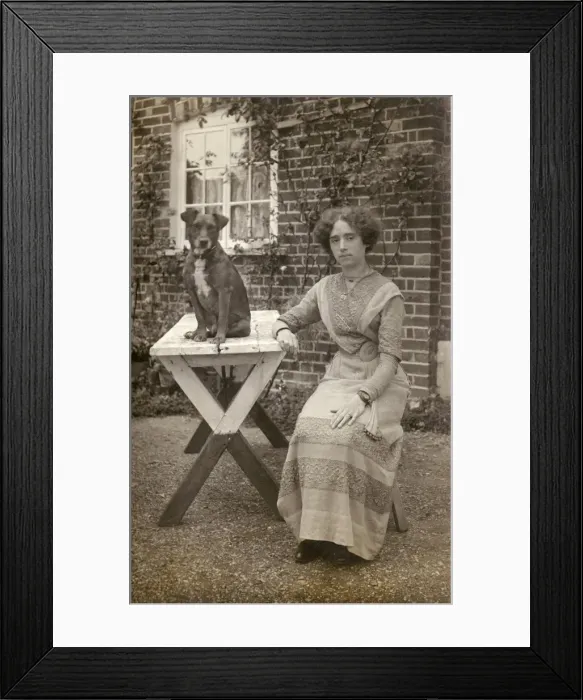 Framed Print : Young woman and dog in garden Framed Print : Young woman and dog in garden