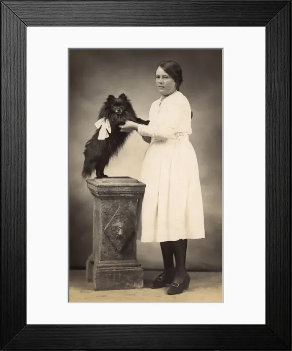 Framed Print : Girl with dog in studio photo