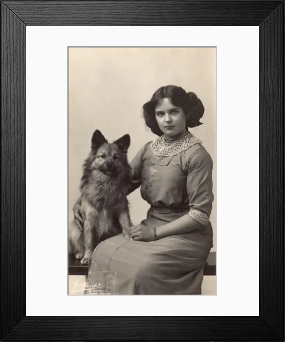 Framed Print : Girl with dog in studio photo Framed Print : Girl with dog in studio photo