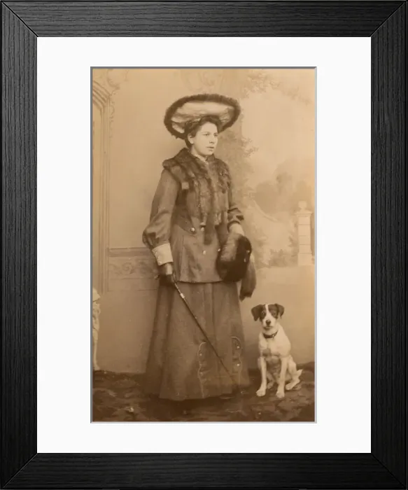 Framed Print : Young woman with dog in studio photo Framed Print : Young woman with dog in studio photo