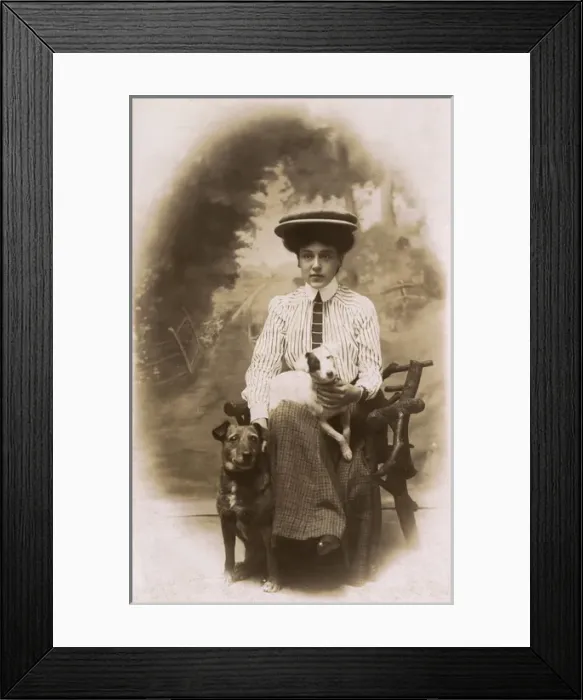 Framed Print : Young woman with two dogs in studio photo Framed Print : Young woman with two dogs in studio photo