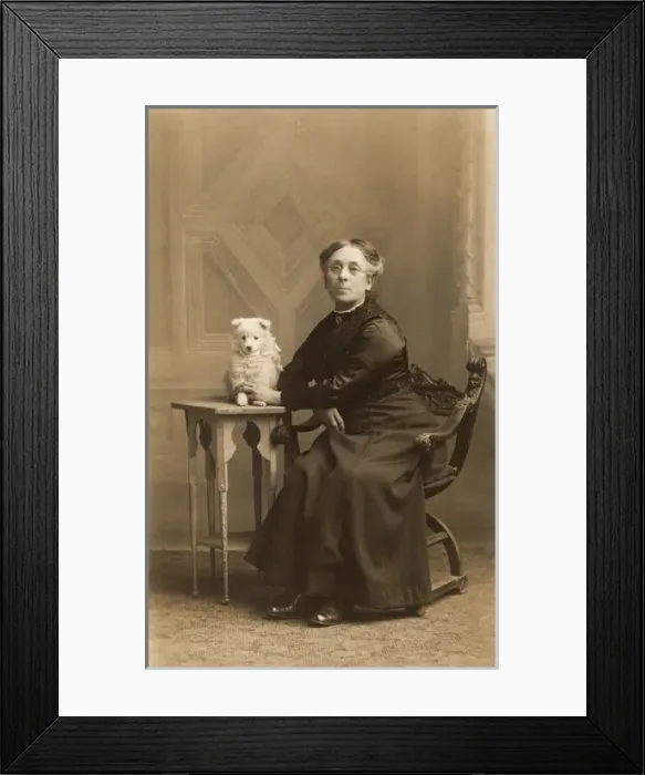 Framed Print : Woman with dog in studio photo Framed Print : Woman with dog in studio photo