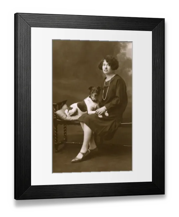 Framed Print : Young woman with dog in studio photo Framed Print : Young woman with dog in studio photo