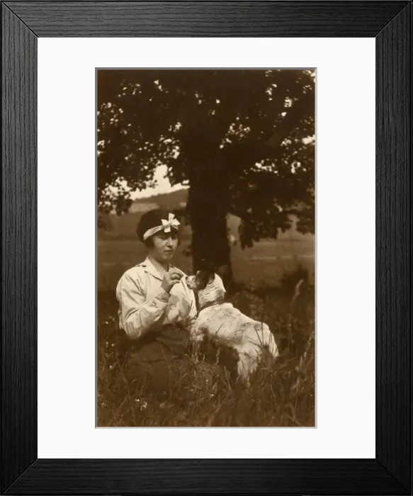 Framed Print : Young woman and dog in field Framed Print : Young woman and dog in field