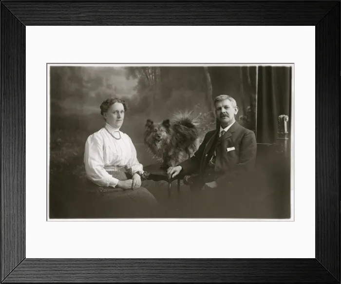 Framed Print : Middle aged couple with dog Framed Print : Middle aged couple with dog