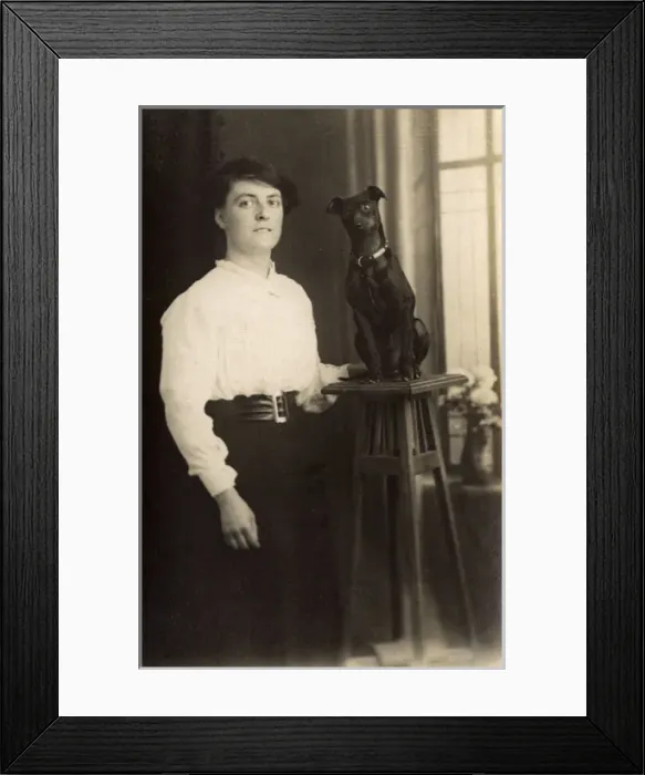 Framed Print : Young woman with dog on pedestal Framed Print : Young woman with dog on pedestal