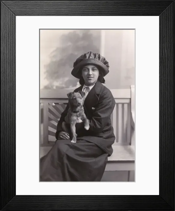 Framed Print : Young woman with a puppy Framed Print : Young woman with a puppy