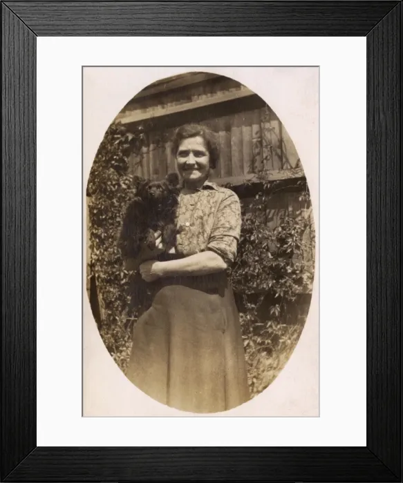 Framed Print : Woman holds her dog Framed Print : Woman holds her dog