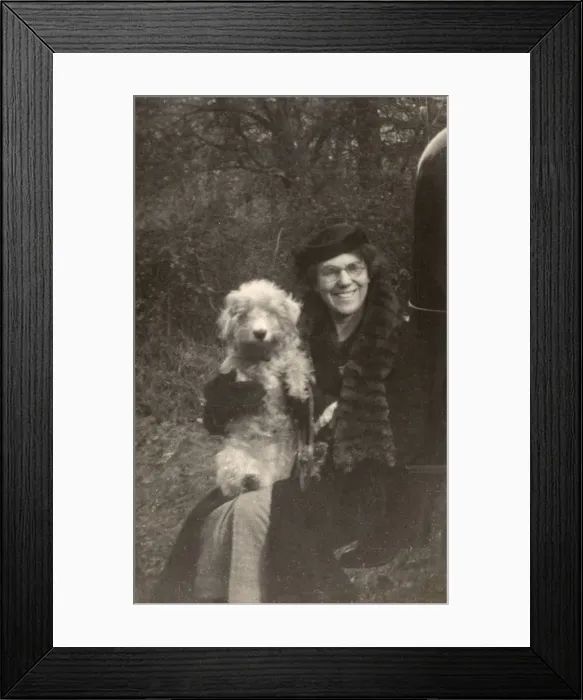 Framed Print : Woman holds her dog Framed Print : Woman holds her dog
