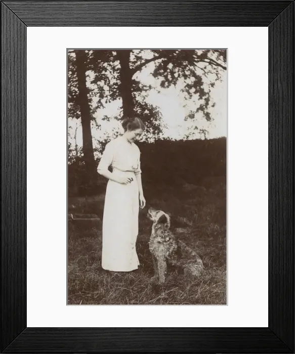 Framed Print : Woman teaches tricks to her dog Framed Print : Woman teaches tricks to her dog